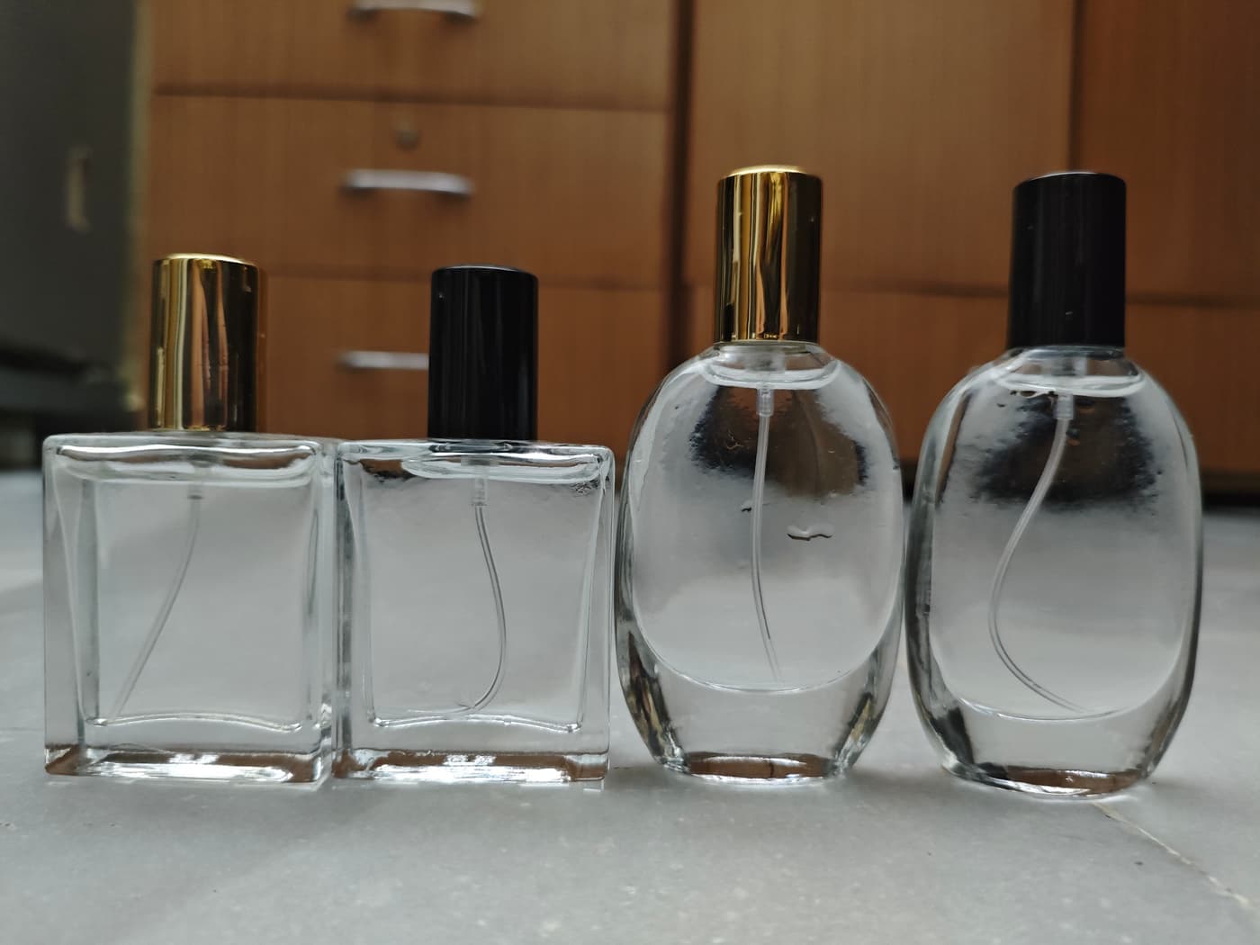 Empty 30ml spray bottle, square and oval, gold and black